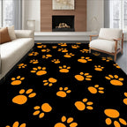 Orange Paw Prints on Black Background Rug